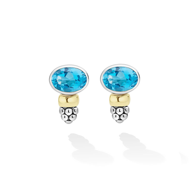 Signature Caviar Two-Tone Swiss Blue Topaz Oval Earrings feature faceted gemstones with silver and gold accents, showcasing LAGOS craftsmanship and elegance.