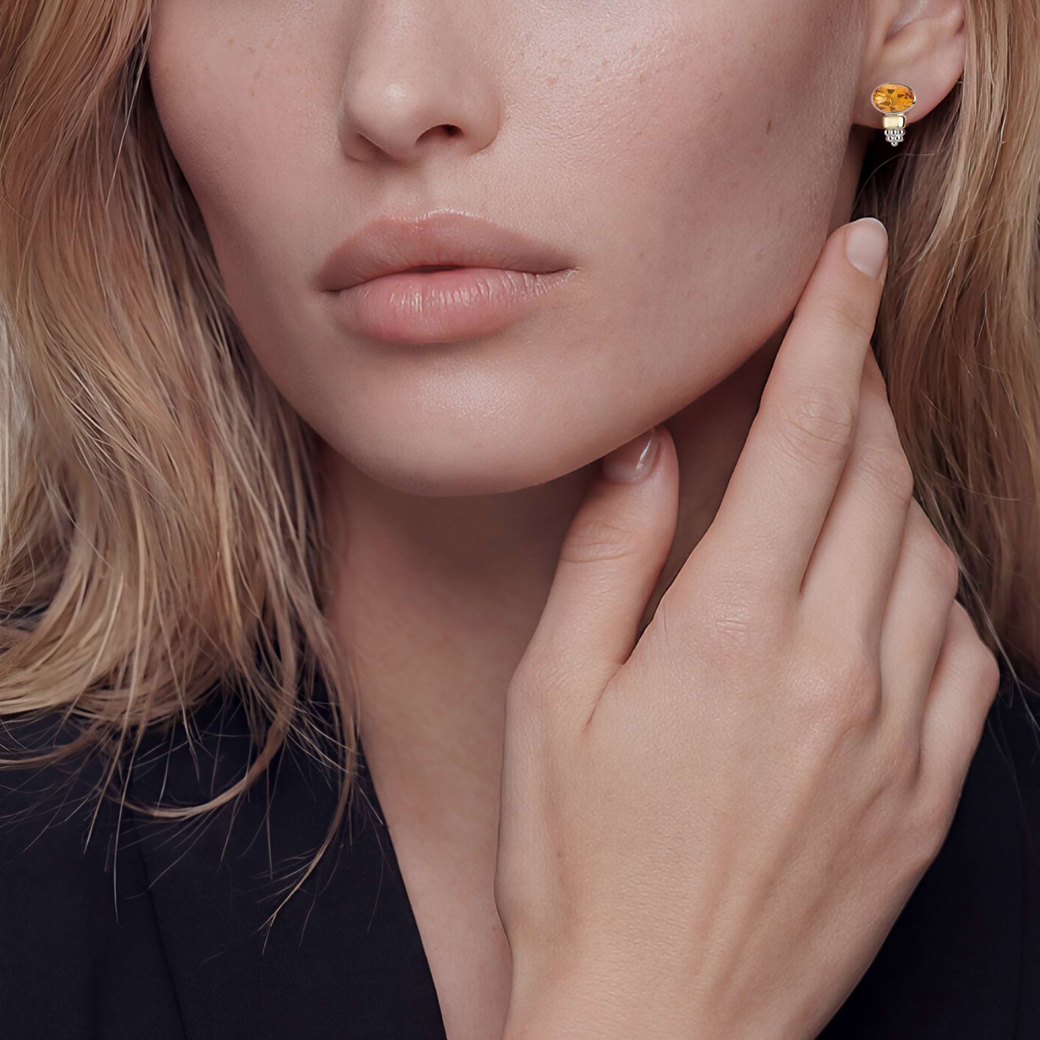 Woman wearing Two-Tone Citrine Oval Stud Earrings