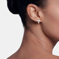 Woman wearing Two-Tone White Topaz Oval Stud Earrings