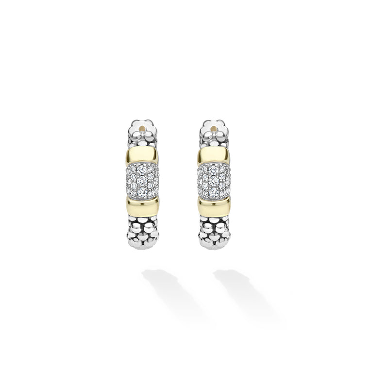 A pair of silver and yellow gold hoop earrings with pavé diamond accents, displayed on a clean white background with soft shadows.