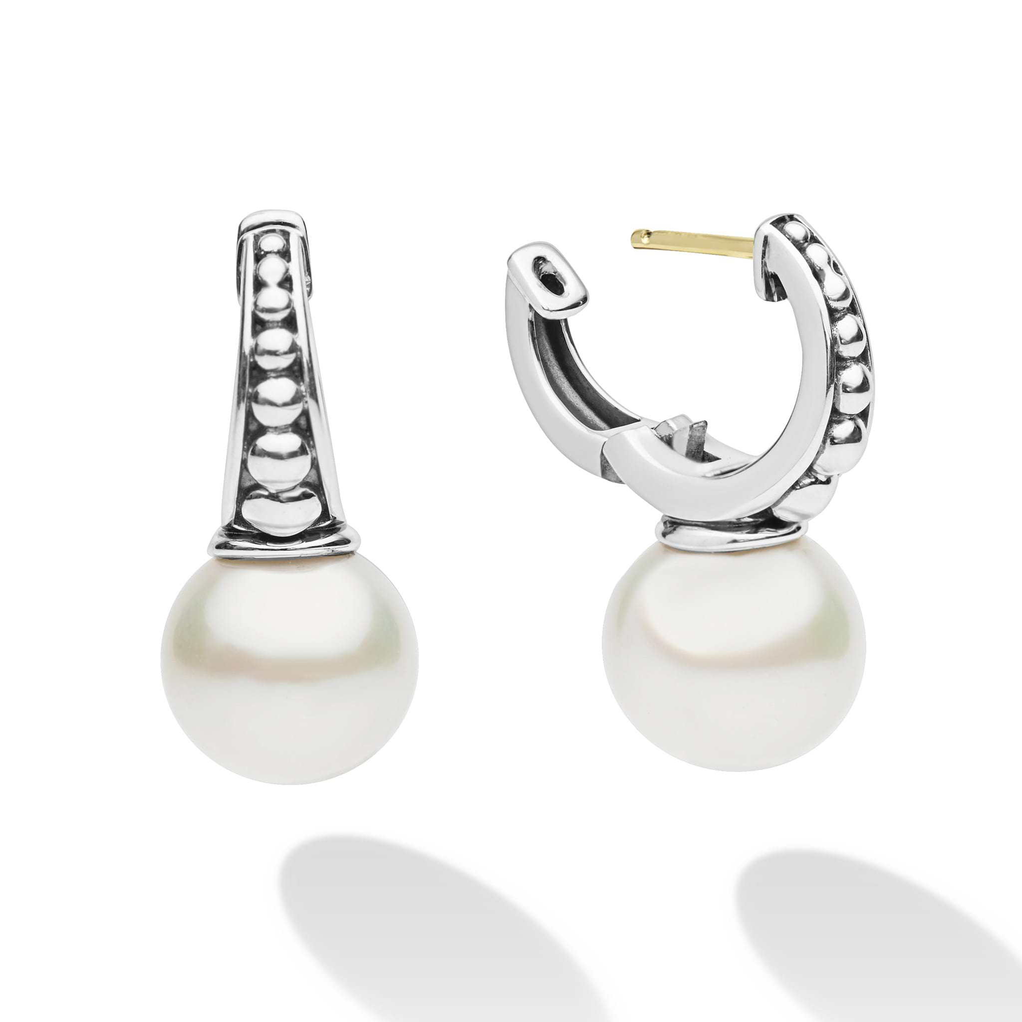 Luna Sterling Silver Pearl Drop Huggie Earrings feature sterling silver hoops with caviar beading and dangling pearls, blending classic elegance with modern design.
