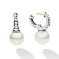 Luna Sterling Silver Pearl Drop Huggie Earrings feature sterling silver hoops with caviar beading and dangling pearls, blending classic elegance with modern design.