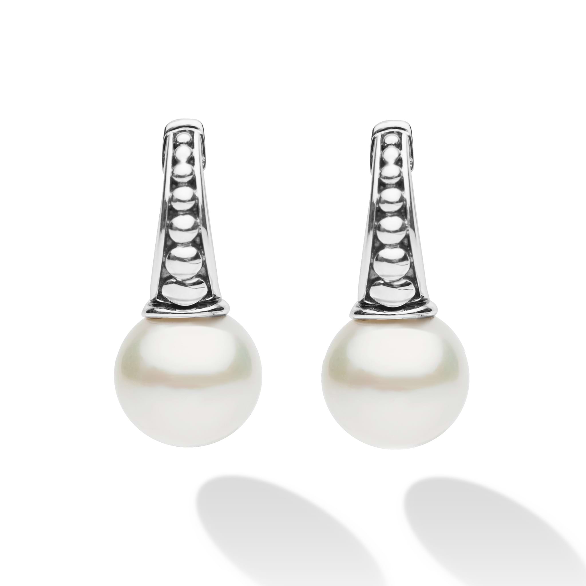Luna Sterling Silver Pearl Drop Huggie Earrings featuring polished sterling silver hoops with triangular accents and round pearl drops, exuding classic elegance with modern flair.