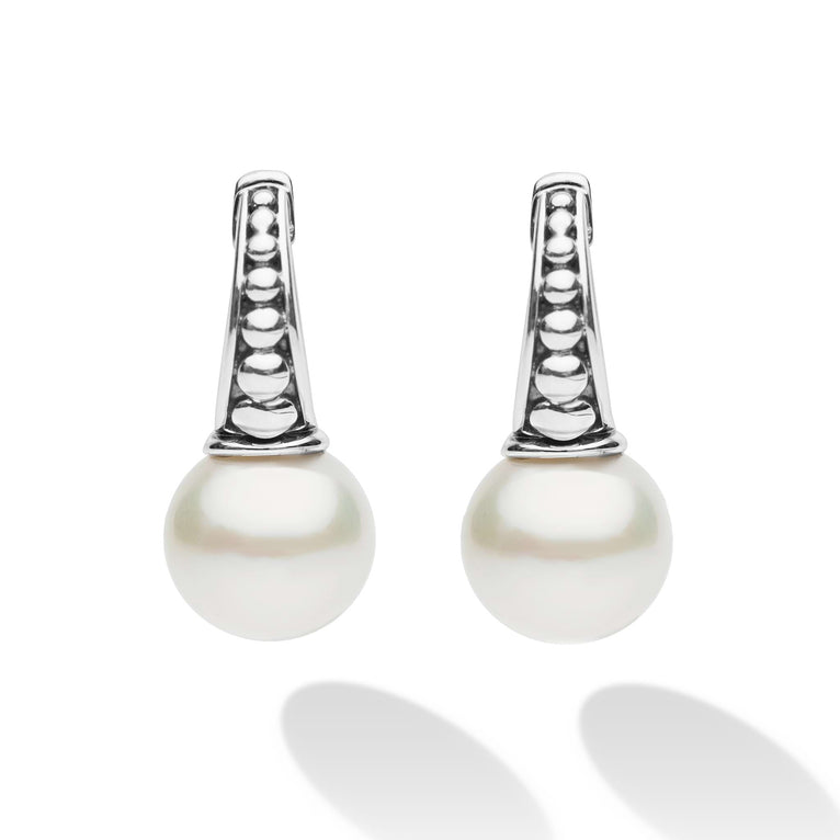 Luna Sterling Silver Pearl Drop Huggie Earrings featuring polished sterling silver hoops with triangular accents and round pearl drops, exuding classic elegance with modern flair.