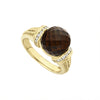 This exquisite ring features a striking Smokey Topaz gemstone, set in 18K gold that highlights its deep, earthy tones. Each side of the gemstone features sparking diamonds and Caviar beading, adding textual contrast and enhancing the overall elegance