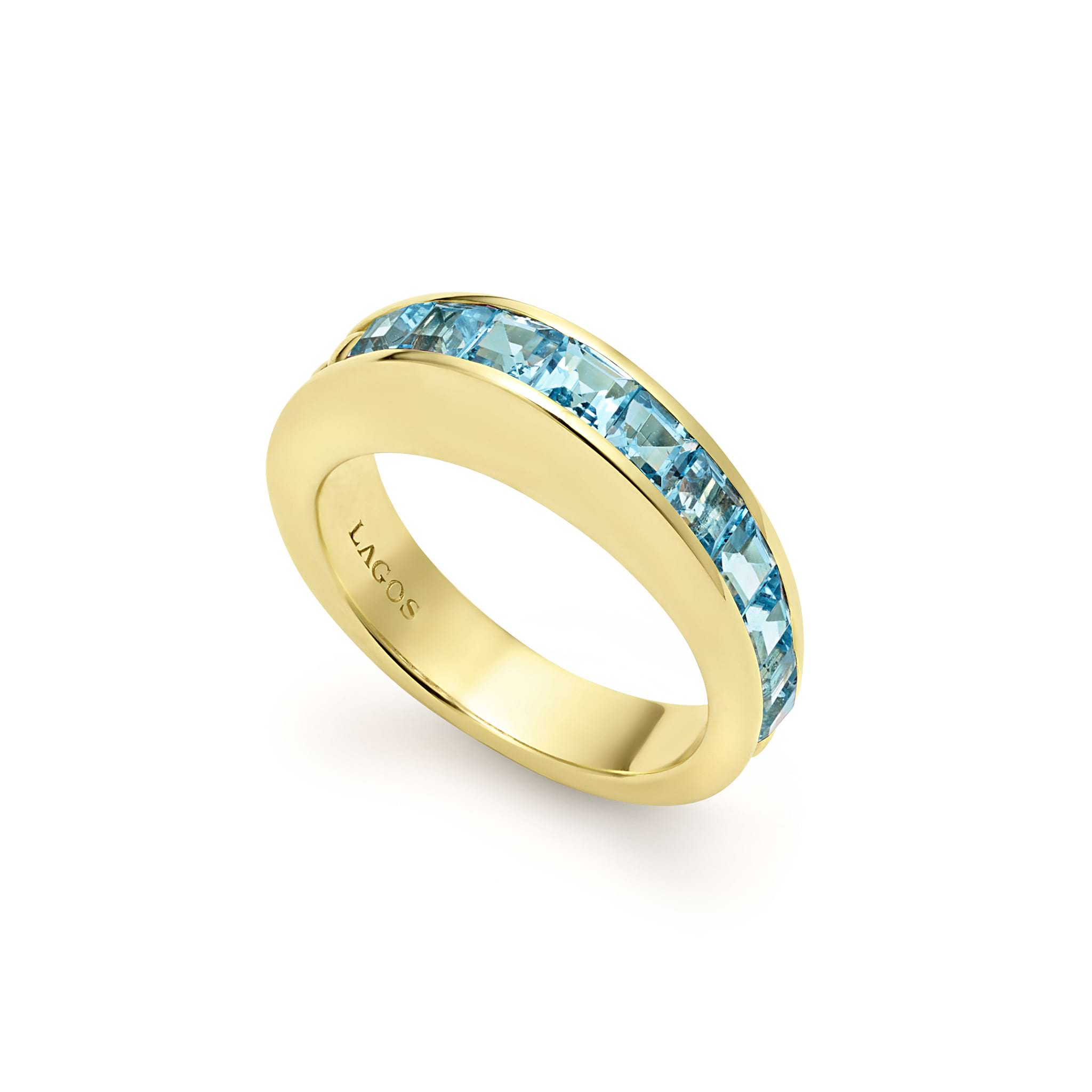 Square cut swiss blue topaz gemstones surrounded by smooth 18K gold form this stacking ring.