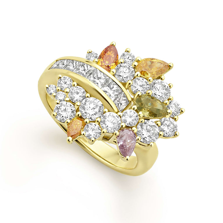 Smooth 18K gold and round diamonds accented with green, orange, purple and yellow pear shape diamonds form this bold statement ring. LAGOS diamonds are the highest quality natural stones.