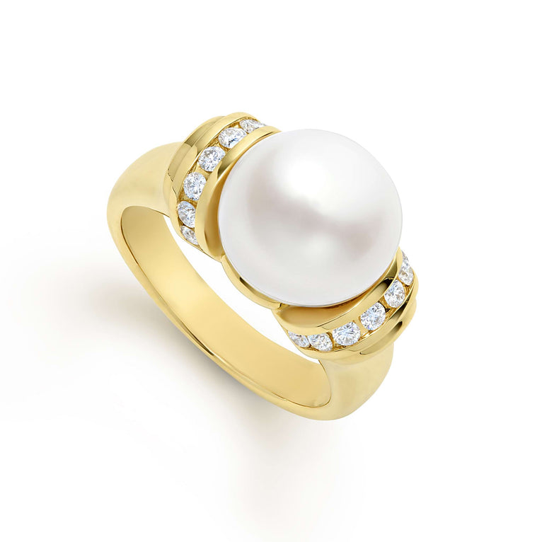 A statement cultured freshwater pearl combined with smooth 18k gold and diamonds form this timeless statement ring. LAGOS diamonds are the highest quality natural stones.