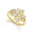 bezel-cut diamond cluster statement ring set in 18K gold on white background
