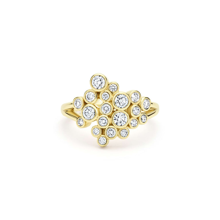front of bezel-cut diamond cluster statement ring set in 18K gold on white background