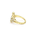 side of bezel-cut diamond cluster statement ring set in 18K gold with LAGOS engraving 