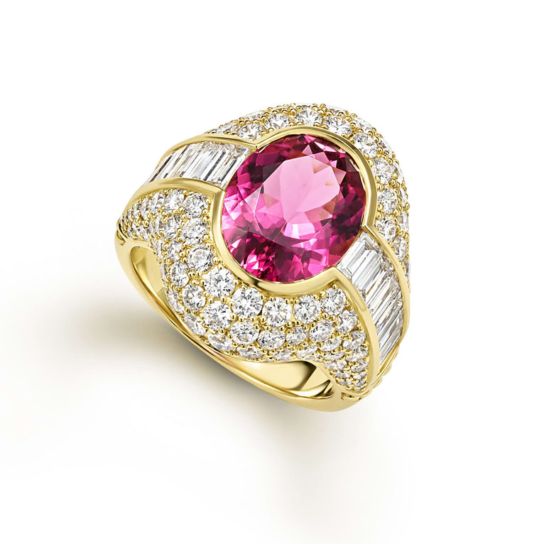 Baguette diamonds and an oval shaped pink rubellite gemstone are set in smooth 18k gold to form this unique ring. LAGOS diamonds are the highest quality natural stones.