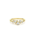 front of nine bezel-cut diamond ring set in 18K gold on a white background