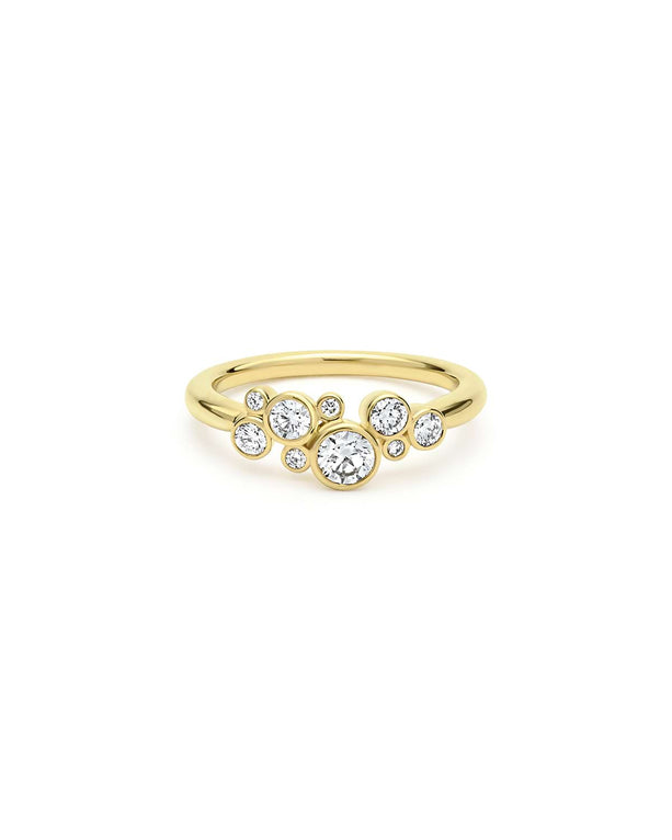 front of nine bezel-cut diamond ring set in 18K gold on a white background