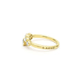 side of nine bezel-cut diamond ring set in 18K gold with LAGOS engraving on  white background