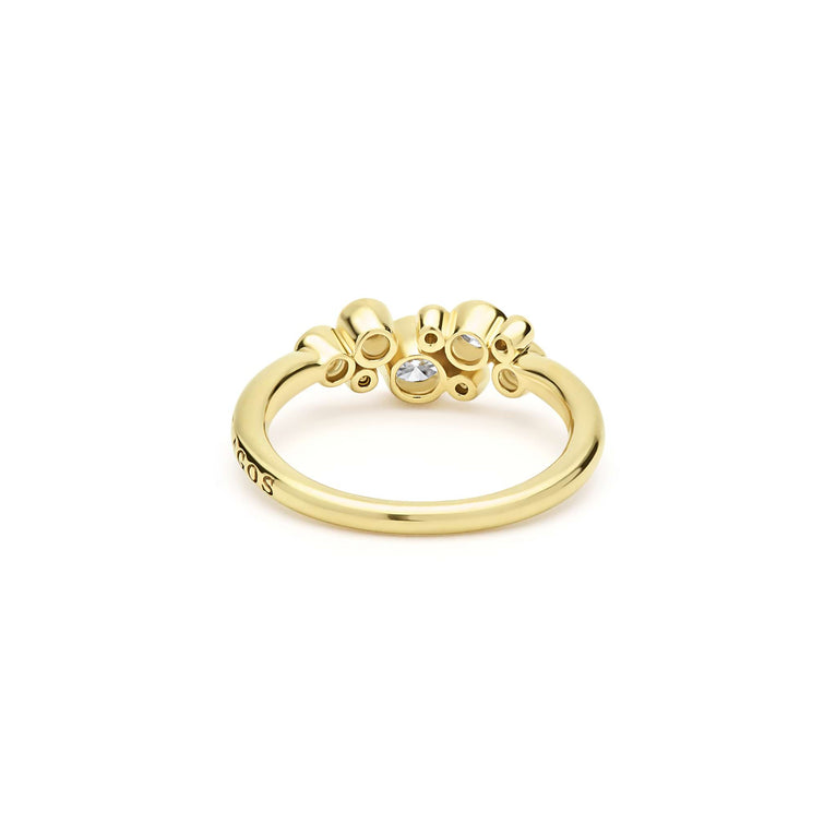 back of nine bezel-cut diamond ring set in 18K gold on white background
