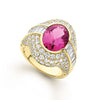 This elegant oval pink Rubellite is accented by two baguette diamonds and encircled by a halo of pavé-set diamonds.