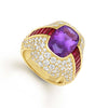 A stunning fusion of vibrant color and timeless design, this 18k gold ring features a cushion-cut amethyst, flanked by two baguette-cut rubies. The 18k gold setting is adorned with 158 pavé diamonds, making this ring an exquisite addition to any jew