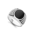 Black agate gemstone and sterling silver Caviar beading form this oval band ring.