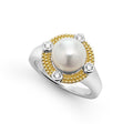 A freshwater cultured pearl surrounded by sterling silver, diamonds, and 18K gold. LAGOS diamonds are the highest quality natural stone.