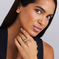 woman wearing sterling silver and black ceramic statement ring with diamond details