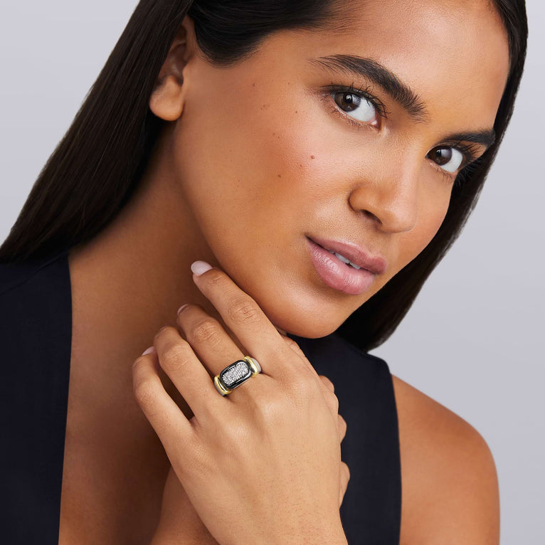 woman wearing sterling silver and black ceramic statement ring with diamond details