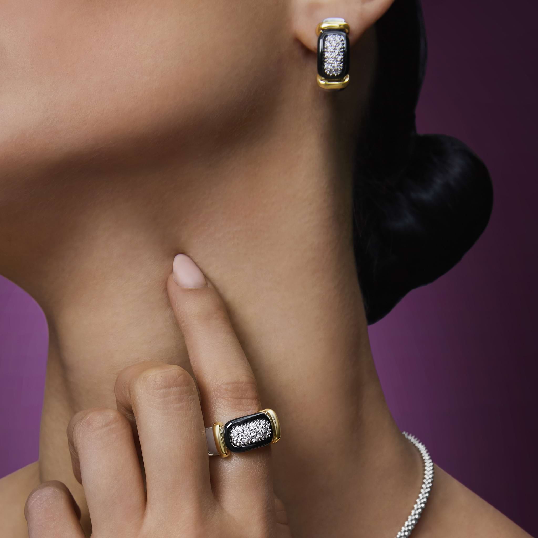 woman styled with sterling silver and black ceramic diamond earrings and ring 