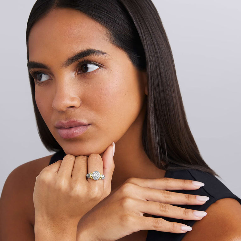 woman wearing sterling silver beaded oval statement ring with gold and diamond details