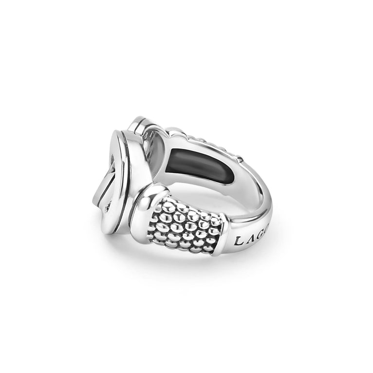 Signature Caviar Large Silver Interlocking Diamond Ring featuring a textured animal head design, polished metal, and pavé diamonds, symbolizing unity and elegance.