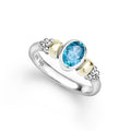 Signature Caviar Two-Tone Swiss Blue Topaz Oval Ring with sterling silver caviar beading, 14K gold accents, and a large faceted Swiss blue topaz centerpiece.