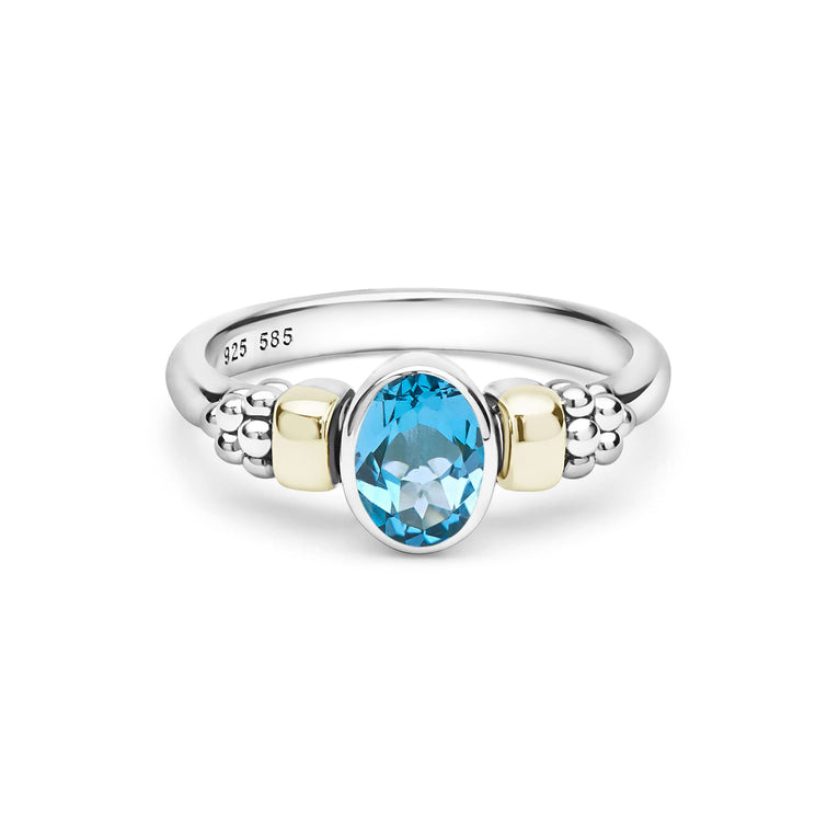 Signature Caviar Two-Tone Swiss Blue Topaz Oval Ring in sterling silver with 14K gold accents, featuring caviar beading and an oval-cut blue gemstone centerpiece.