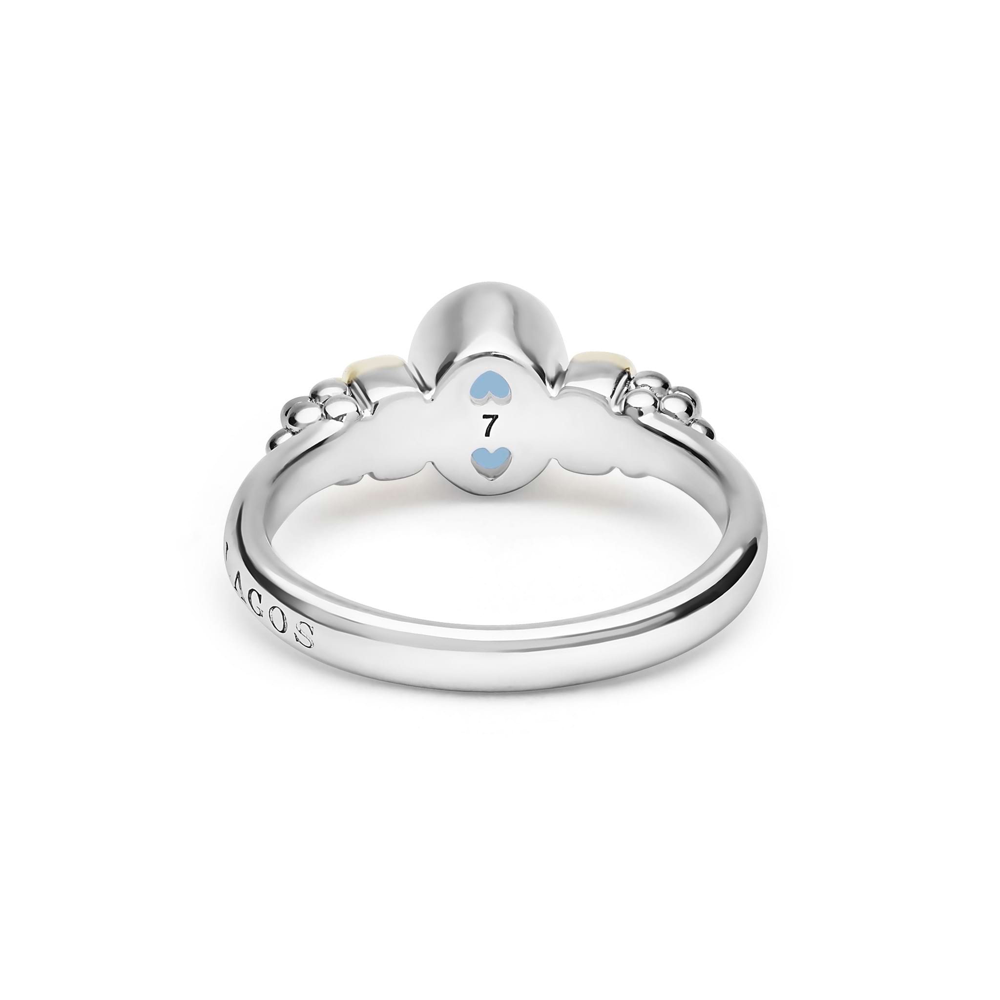 Signature Caviar Two-Tone Swiss Blue Topaz Oval Ring featuring sterling silver caviar beading, 14K gold accents, and a vivid oval Swiss blue topaz gemstone.