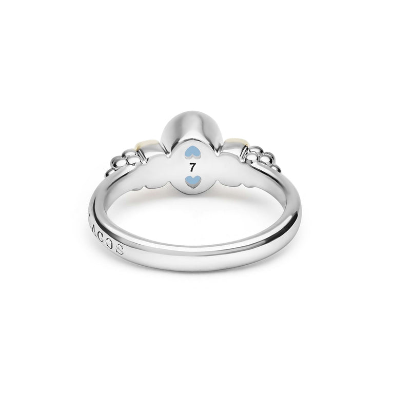Signature Caviar Two-Tone Swiss Blue Topaz Oval Ring featuring sterling silver caviar beading, 14K gold accents, and a vivid oval Swiss blue topaz gemstone.