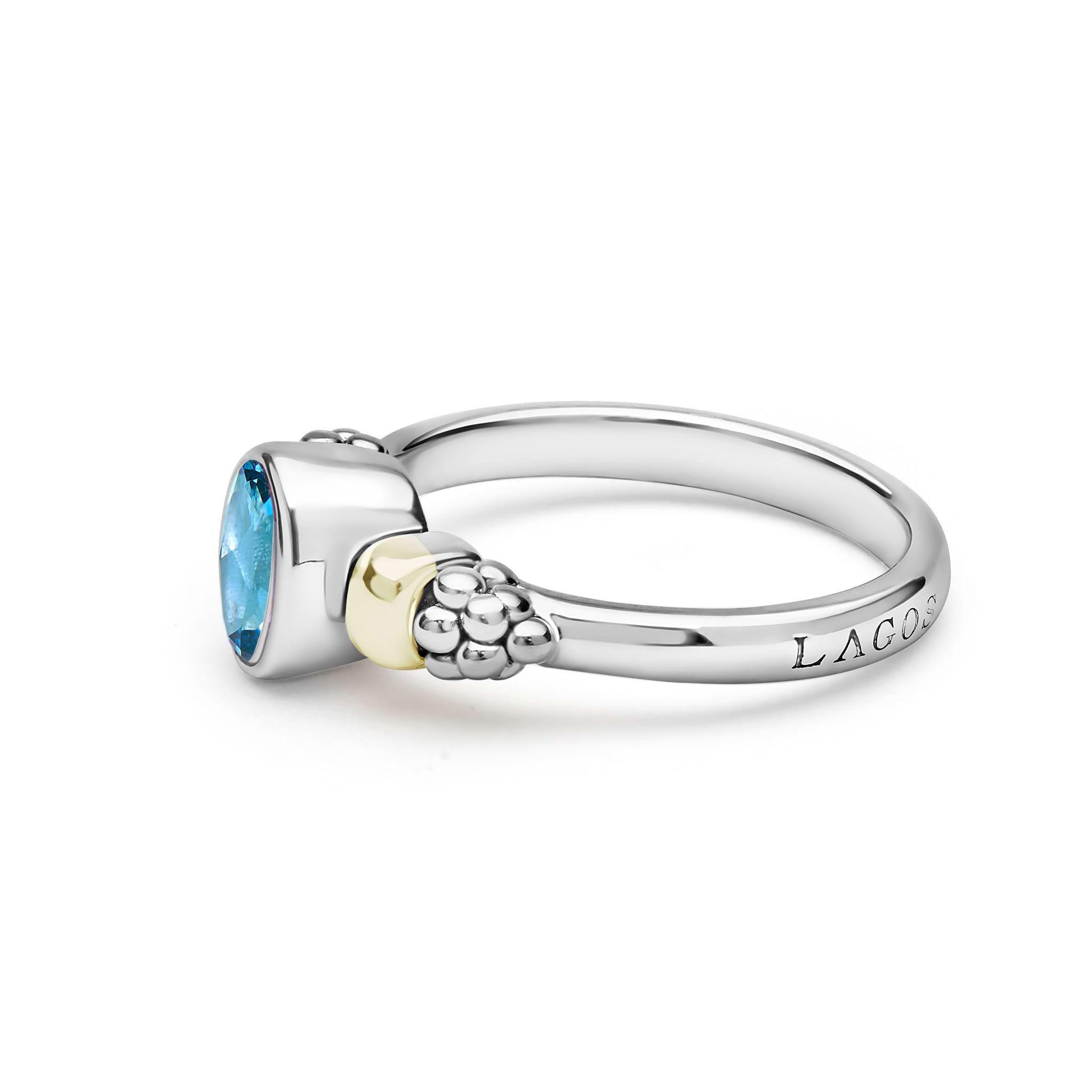 Signature Caviar Two-Tone Swiss Blue Topaz Oval Ring featuring sterling silver, 18K gold accent, faceted blue topaz, with caviar beading on the shoulders.