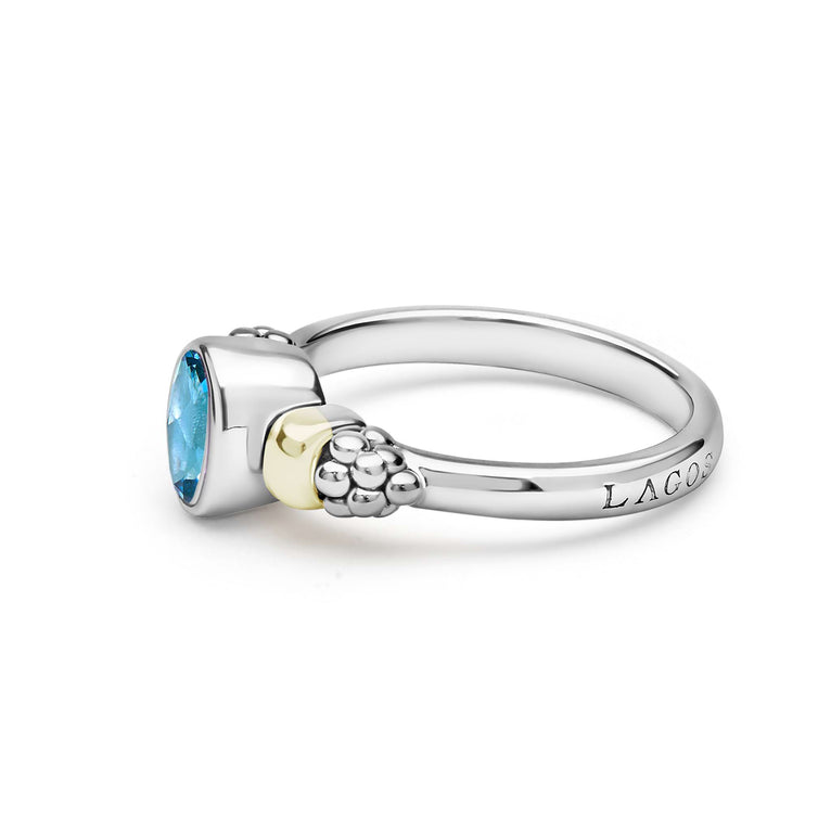 Signature Caviar Two-Tone Swiss Blue Topaz Oval Ring featuring sterling silver, 18K gold accent, faceted blue topaz, with caviar beading on the shoulders.