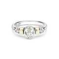 Signature Caviar Two-Tone White Topaz Oval Ring featuring a sterling silver band with 14K gold accents, caviar beading, and a central faceted white topaz gemstone.