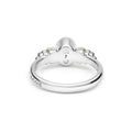 Signature Caviar Two-Tone White Topaz Oval Ring in sterling silver with heart motifs, maker’s mark visible, featuring caviar beading and polished 14K gold details.