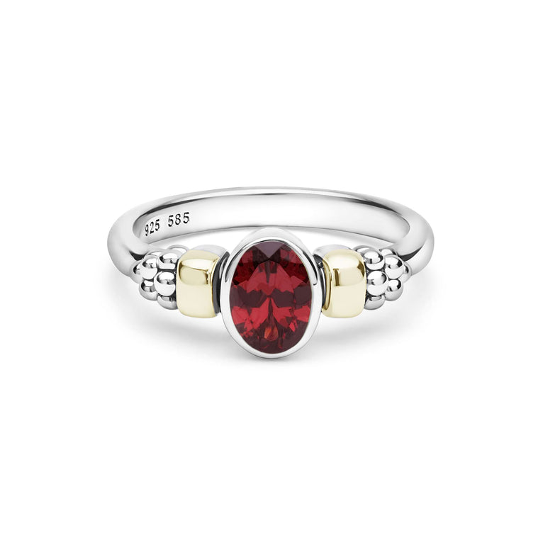 Signature Caviar Two-Tone Garnet Oval Ring featuring a central red garnet, sterling silver band, and 14K gold accents with caviar beading.