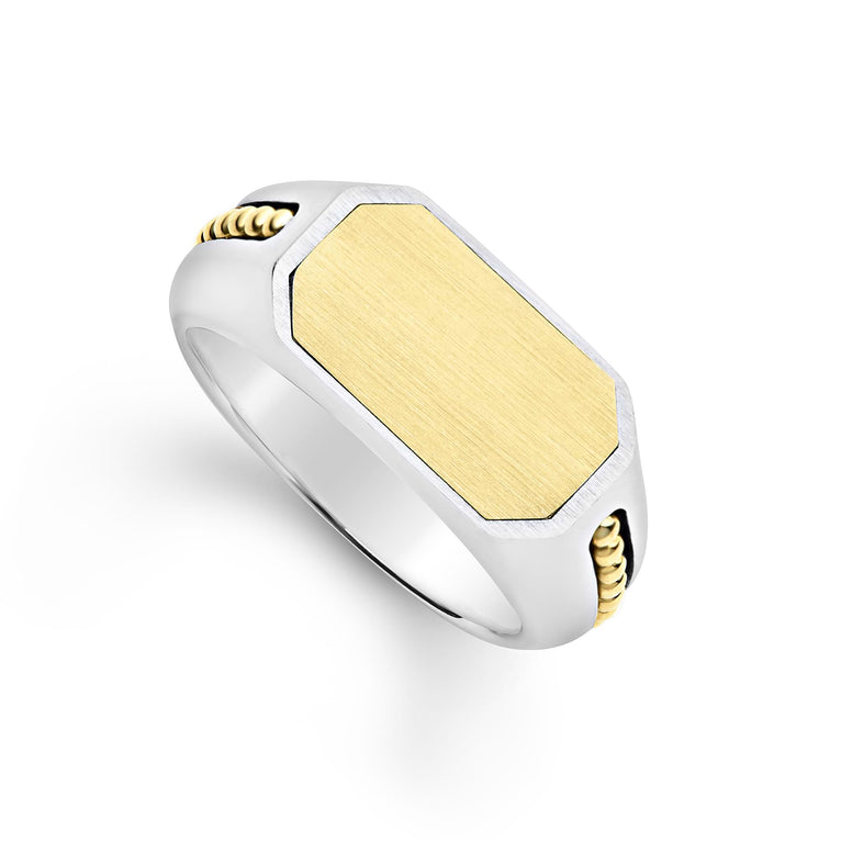 18K gold and sterling silver forms this statement ring.