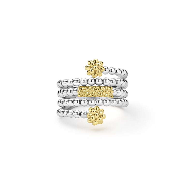  three row ring with gold and silver designs on a white background
