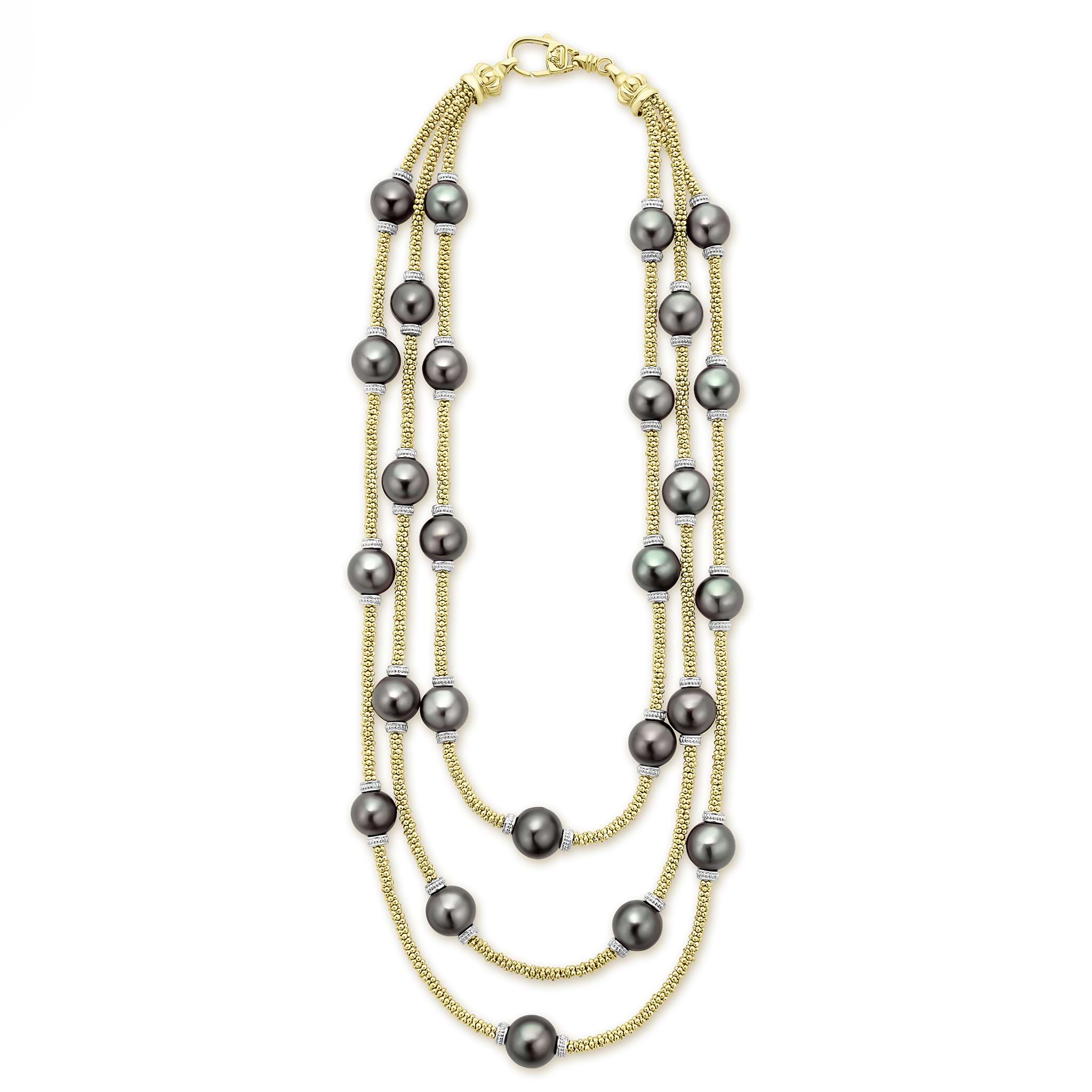 Tahitian black pearl stations highlighted on a 18K gold beaded necklace.