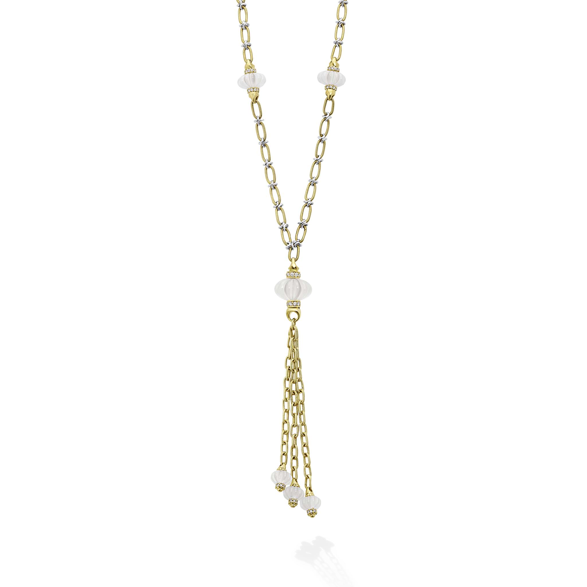 Elegant and refined, this 18K gold necklace features milky quartz beads along an oval flat-link chain, finished with a graceful tassel for timeless sophistication