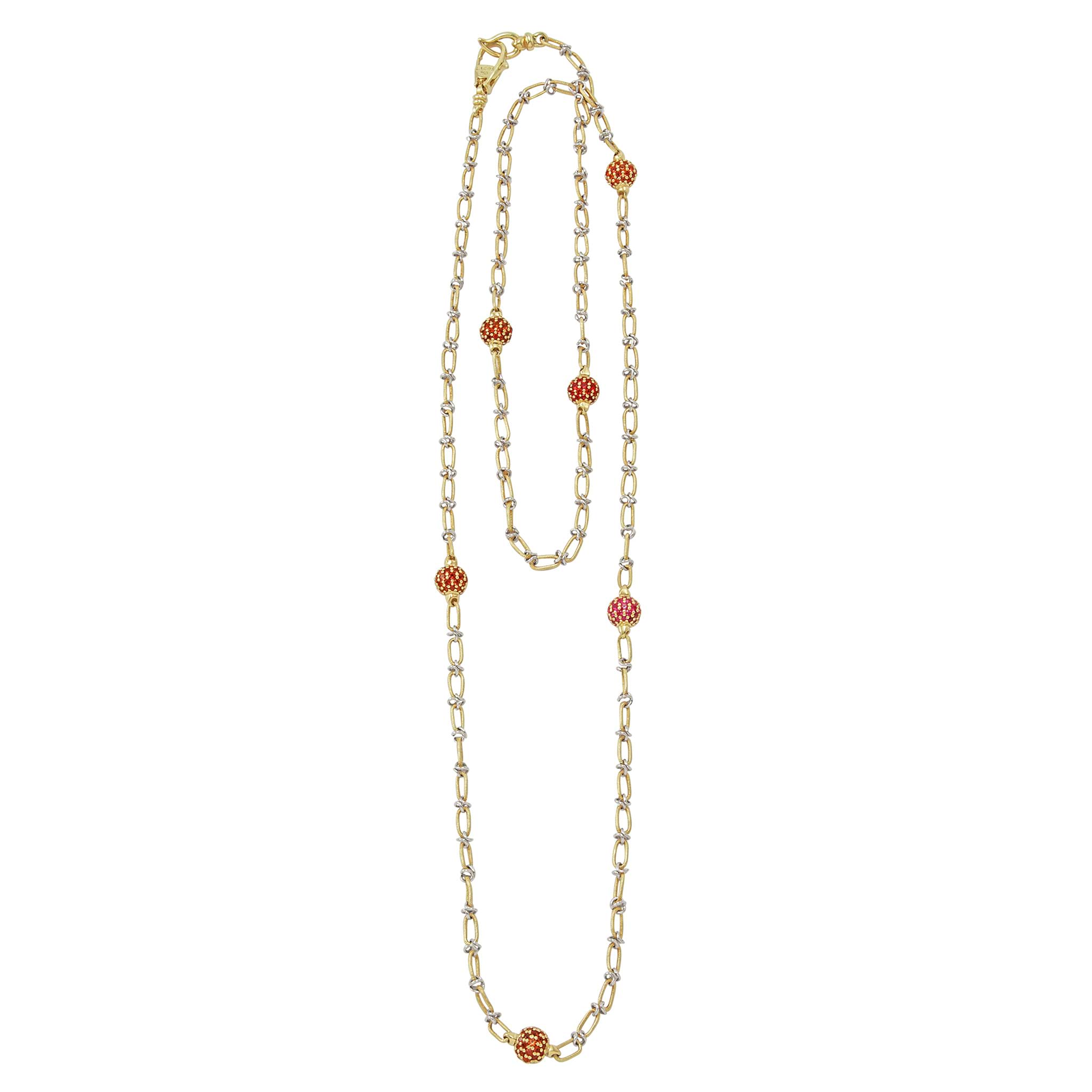 18k gold and yellow sapphire gemstone stations form this long necklace.