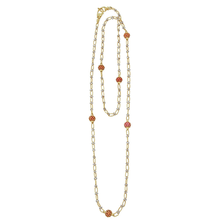 18k gold and yellow sapphire gemstone stations form this long necklace.