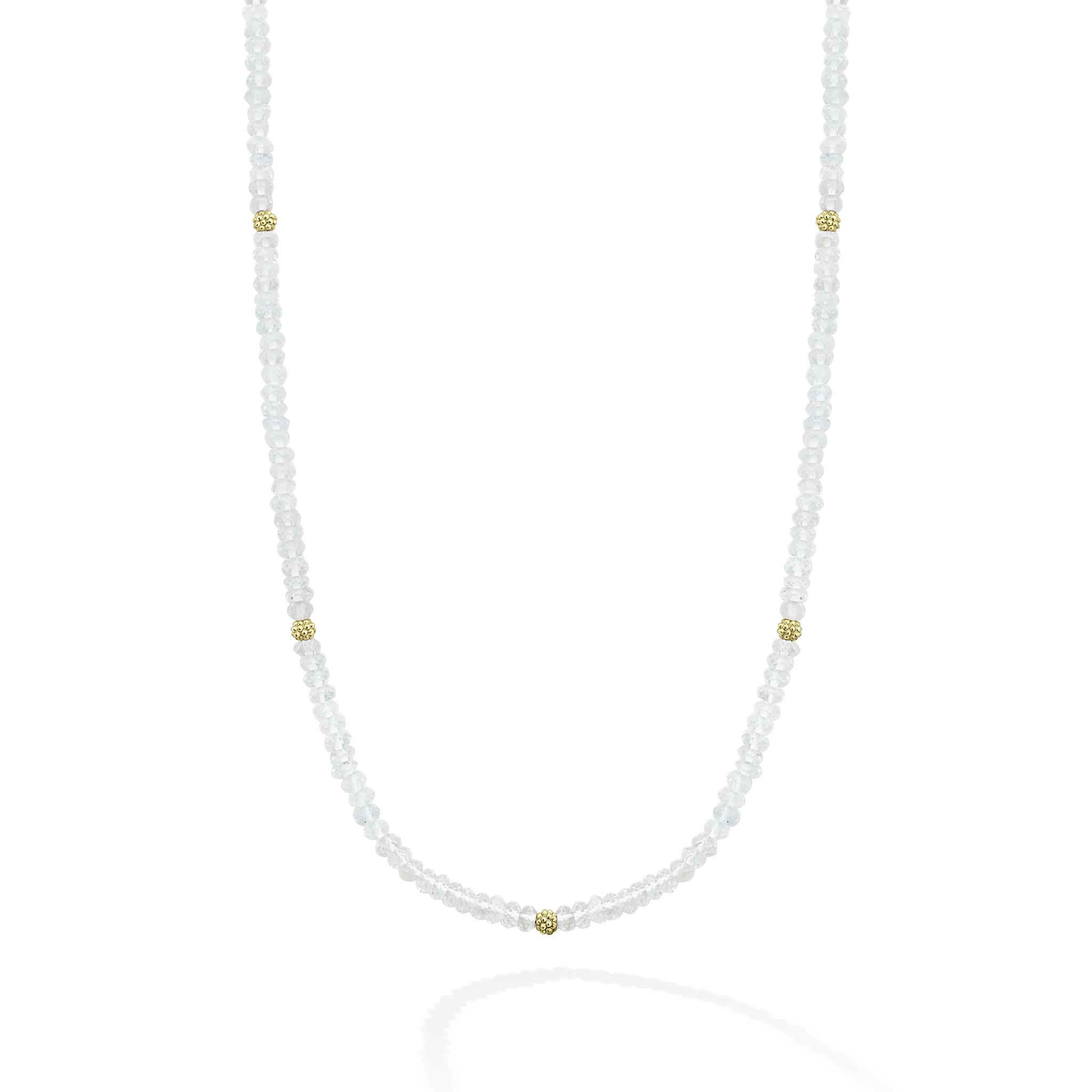 Seven 18K gold stations surrounded by Aquamarine Caviar beading forms this strand necklace.