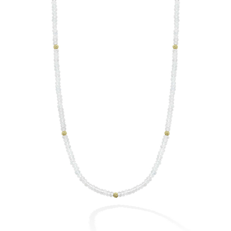 Seven 18K gold stations surrounded by Aquamarine Caviar beading forms this strand necklace.