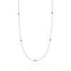 Seven 18K gold stations surrounded by Rose Quartz Caviar beading forms this strand necklace.