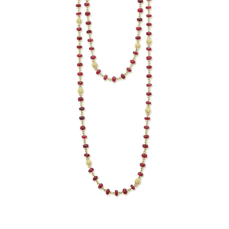 A ruby gemstone necklace with 18K gold Caviar beading form this beaded necklace.