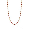 18k gold and ruby gemstone stations form this necklace.