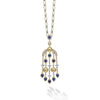 Featuring nine oval facet-cut blue sapphires, this stunning piece captures the brilliance and depth of gemstones. Each sapphire is accented by radiant diamonds, creating a mesmerizing cascade of color and sparkle.